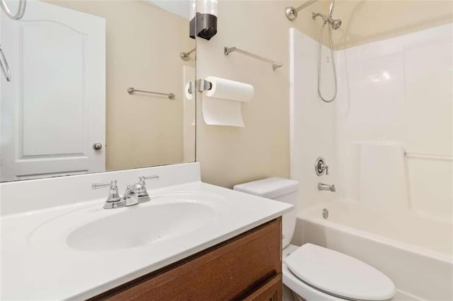 full bathroom with vanity, toilet, and  shower combination