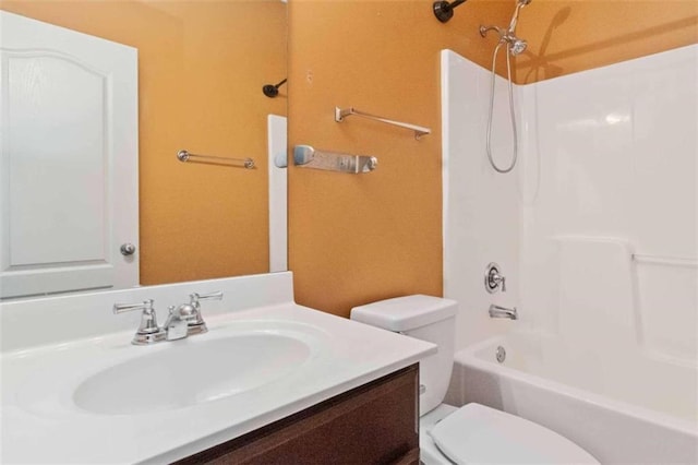 full bathroom featuring vanity, shower / tub combination, and toilet