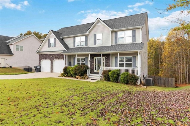 view of front of property featuring central AC, a front lawn, a garage, and a porch