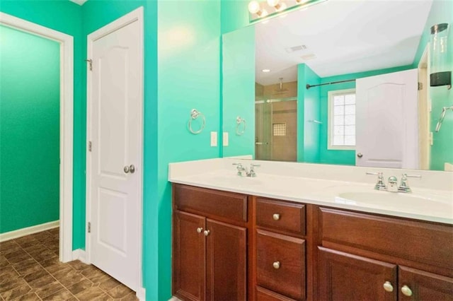 bathroom featuring walk in shower and vanity