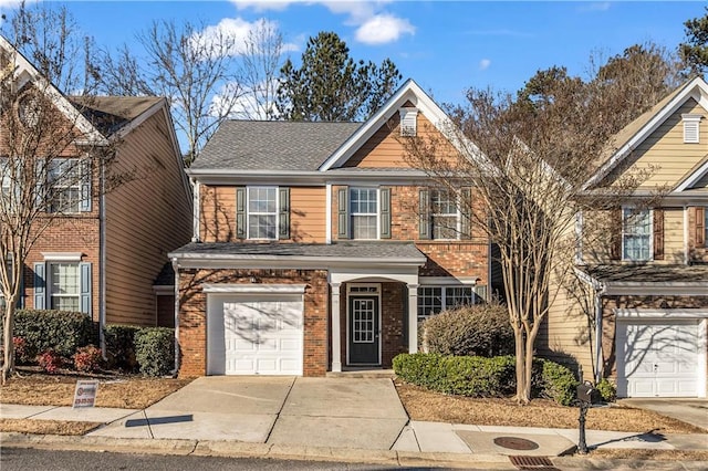 view of front of house with an attached garage, driveway, roof with shingles, and brick siding