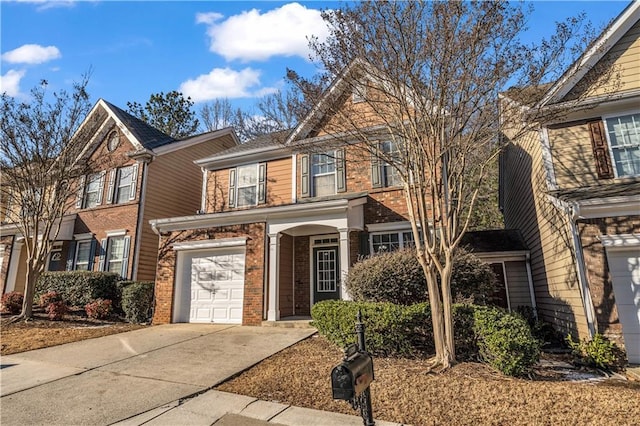 view of front of property featuring driveway, brick siding, and an attached garage