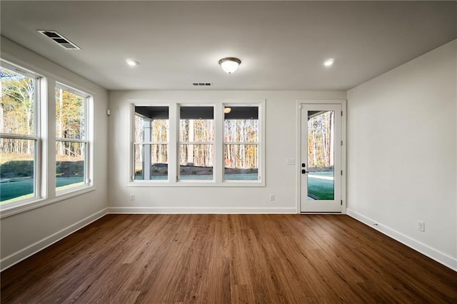 unfurnished room featuring dark hardwood / wood-style floors