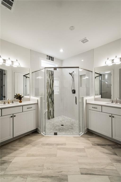 bathroom featuring vanity and walk in shower