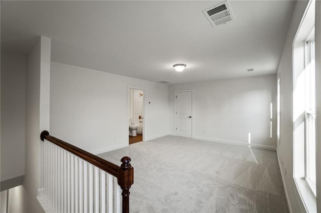 unfurnished room featuring carpet floors