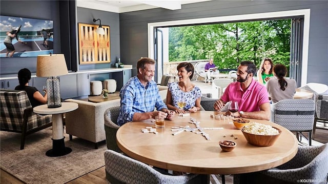 dining room with wooden walls