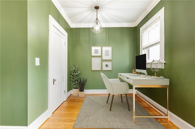 home office featuring light wood-style floors, baseboards, and ornamental molding