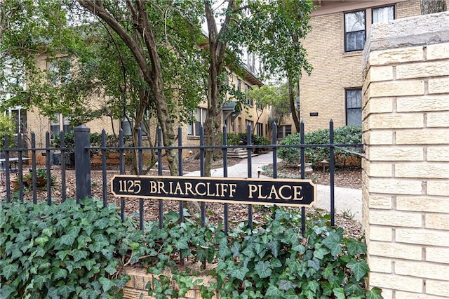 community sign with fence