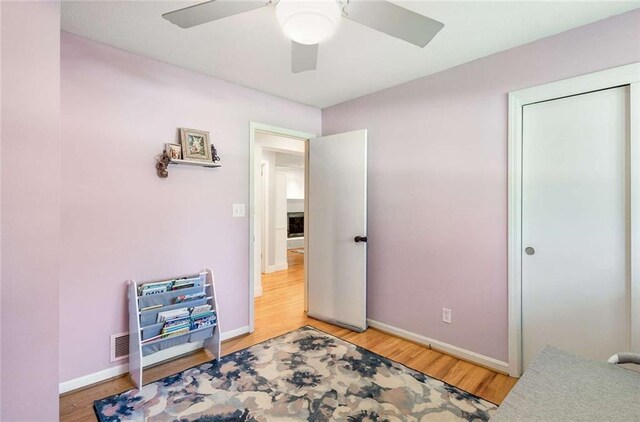 bedroom featuring hardwood / wood-style floors and ceiling fan