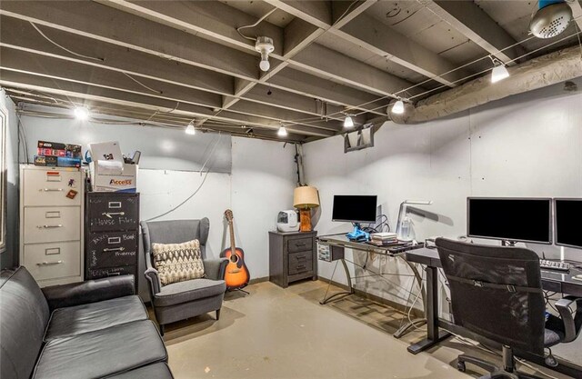 home office with concrete flooring