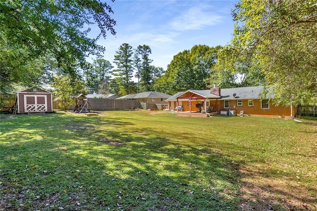 view of yard with a patio area and a shed