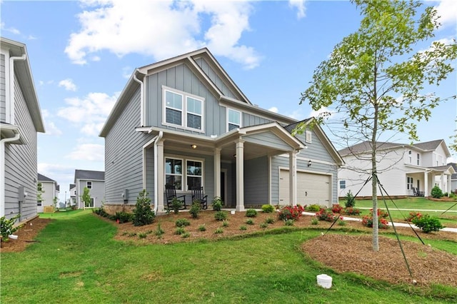 craftsman inspired home with a front yard and a garage