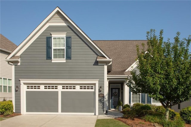 3719 Cresswind Pkwy SW, Gainesville, GA 30504 - traditional-style house with driveway, an attached garage, and a shingled roof
