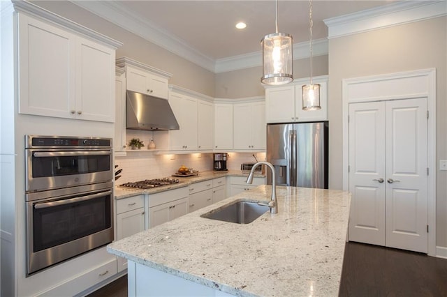 3719 Cresswind Pkwy SW, Gainesville, GA 30504 - kitchen with appliances with stainless steel finishes, under cabinet range hood, white cabinetry, ornamental molding, and backsplash