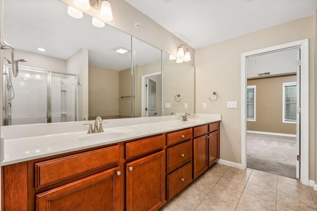 bathroom featuring vanity, tile patterned floors, and an enclosed shower