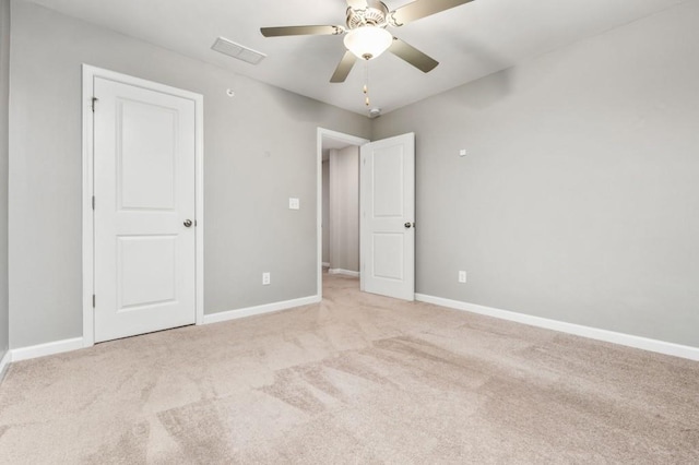 empty room with light carpet and ceiling fan