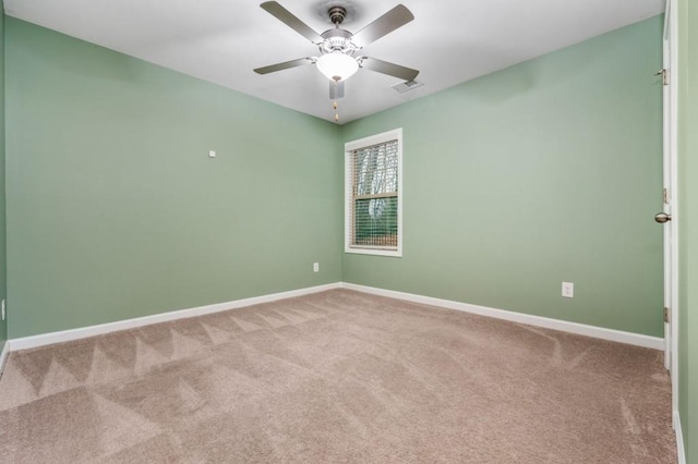 empty room with carpet floors and ceiling fan