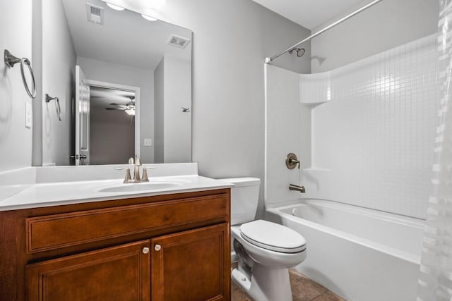 full bathroom featuring vanity, tile patterned flooring, ceiling fan, toilet, and shower / tub combo