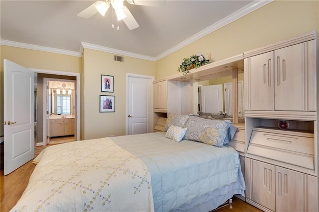 bedroom featuring ceiling fan, visible vents, ornamental molding, and light wood finished floors
