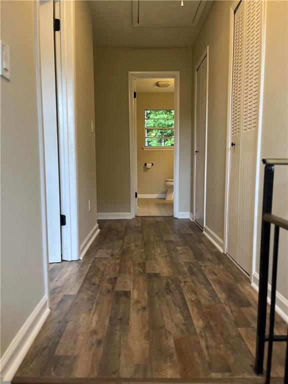 4701 Flat Shoals Rd Unit 41-F, Union City, GA 30291 - hallway with wood finished floors, attic access, and baseboards