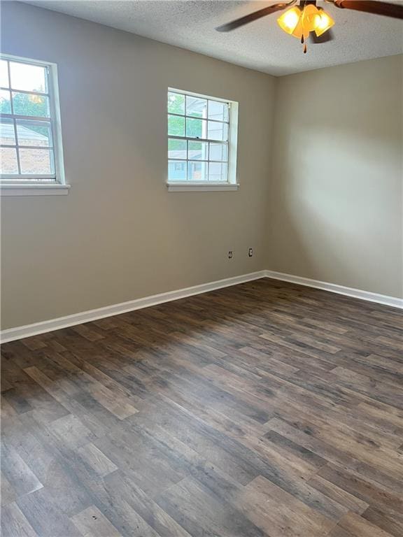 4701 Flat Shoals Rd Unit 41-F, Union City, GA 30291 - empty room with ceiling fan, dark wood-style floors, baseboards, and a textured ceiling