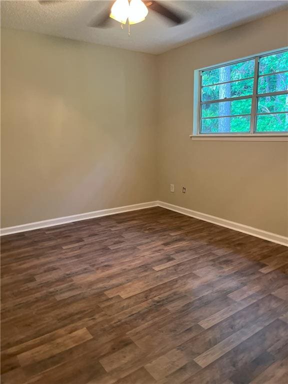 4701 Flat Shoals Rd Unit 41-F, Union City, GA 30291 - unfurnished room with a ceiling fan, dark wood-style floors, baseboards, and a textured ceiling