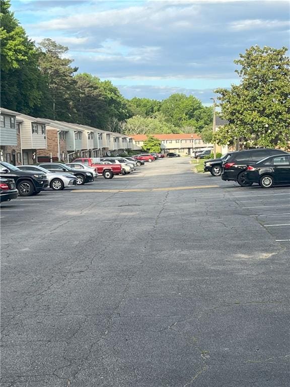 4701 Flat Shoals Rd Unit 41-F, Union City, GA 30291 - uncovered parking lot featuring a residential view