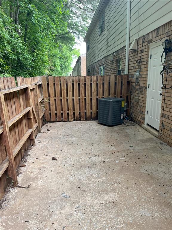 4701 Flat Shoals Rd Unit 41-F, Union City, GA 30291 - view of yard with cooling unit and fence