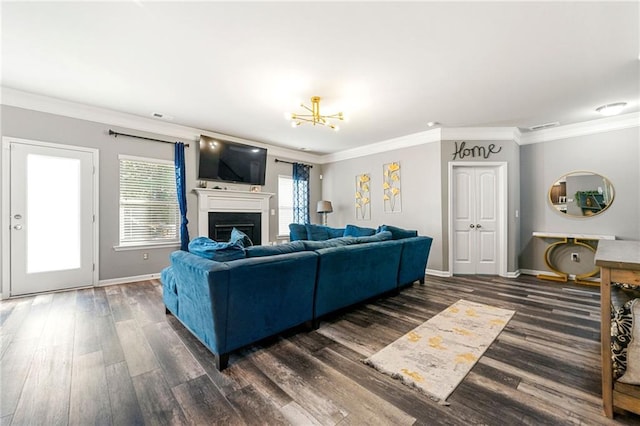 living area featuring a fireplace, crown molding, and wood finished floors