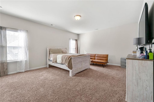 carpeted bedroom with baseboards