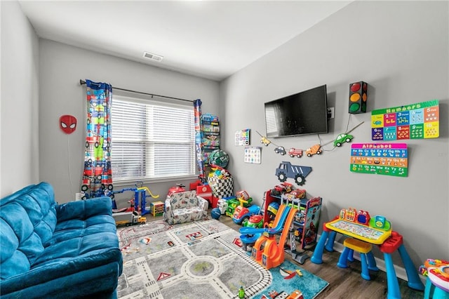 game room with wood finished floors and visible vents