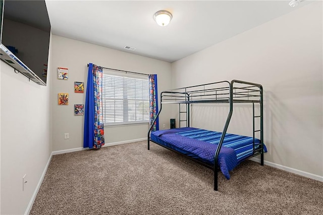 bedroom with baseboards, visible vents, and carpet flooring