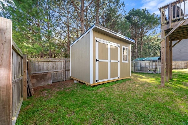 view of shed featuring a fenced backyard