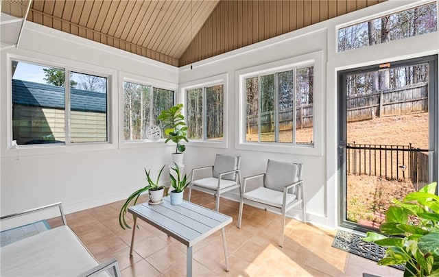 sunroom with vaulted ceiling and wooden ceiling