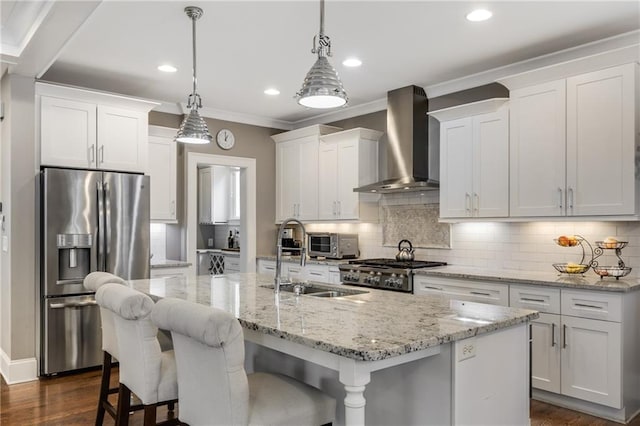 kitchen featuring wall chimney range hood, crown molding, white cabinets, stainless steel refrigerator with ice dispenser, and stove