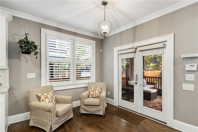 living area featuring baseboards, french doors, wood finished floors, and ornamental molding