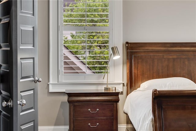 bedroom featuring baseboards