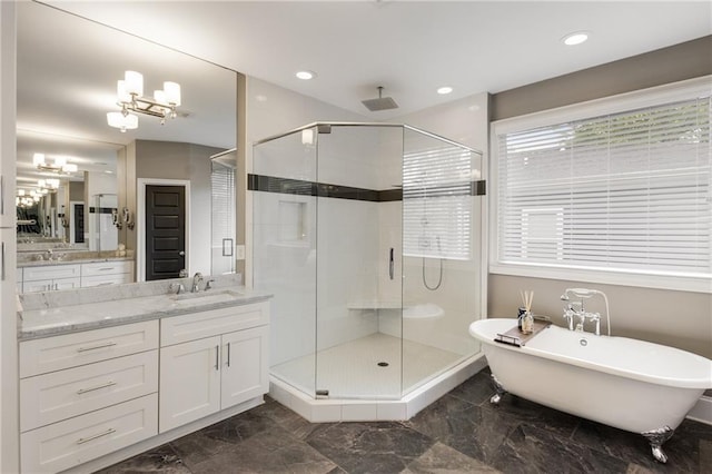 full bath featuring marble finish floor, vanity, a chandelier, and a stall shower