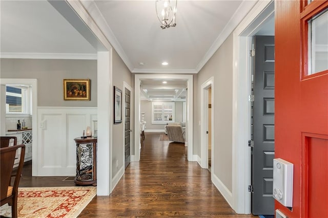 hall featuring recessed lighting, dark wood finished floors, and ornamental molding