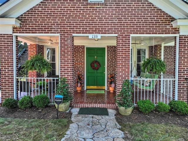 entrance to property with ceiling fan