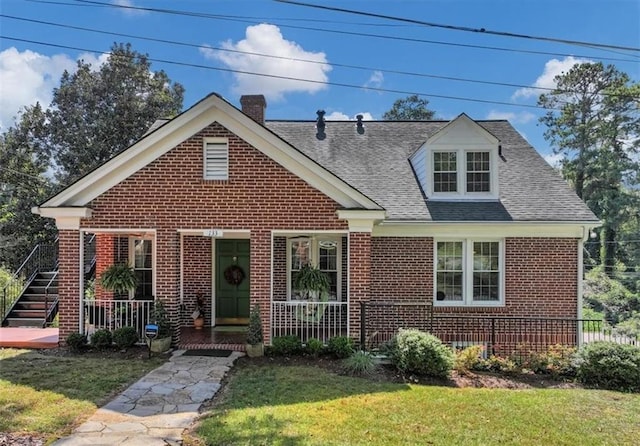 view of front facade with a front lawn and a porch