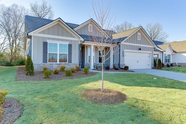 craftsman-style home featuring a garage and a front yard