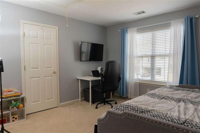 bedroom featuring light colored carpet