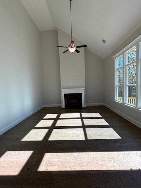 unfurnished living room featuring ceiling fan and lofted ceiling