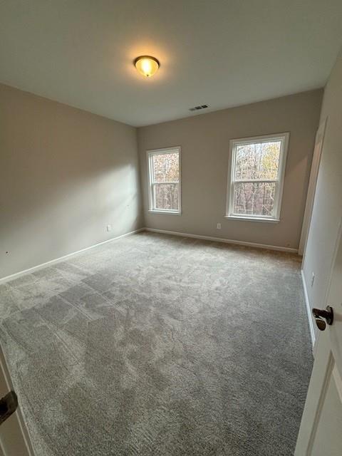 empty room featuring carpet floors