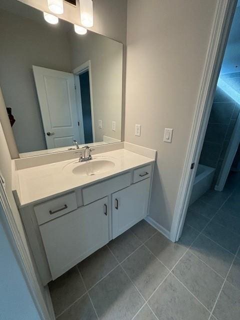 bathroom featuring tile patterned flooring and vanity