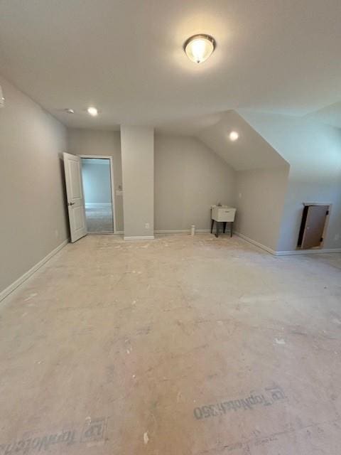 bonus room featuring vaulted ceiling