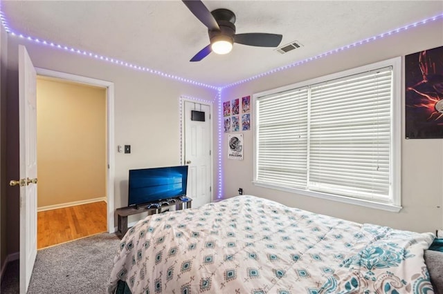 250 Kensington Trce, Stockbridge, GA 30281 - carpeted bedroom with baseboards and a ceiling fan