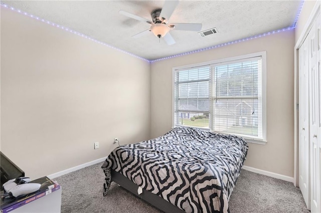 250 Kensington Trce, Stockbridge, GA 30281 - carpeted bedroom featuring a closet, baseboards, and ceiling fan