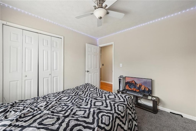 250 Kensington Trce, Stockbridge, GA 30281 - carpeted bedroom with a closet, baseboards, and a ceiling fan